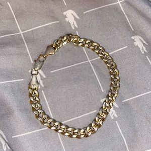 14k gold Cuban link bracelet.